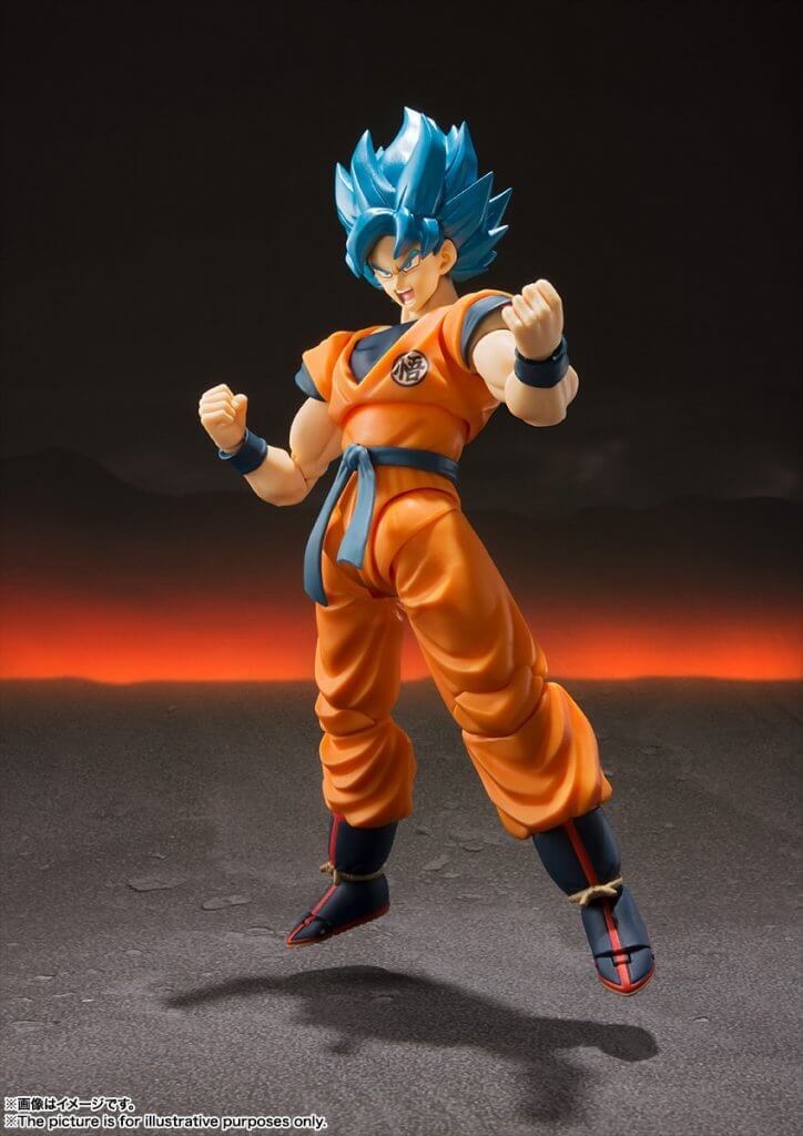 Action figure in orange and blue outfit with blue hair against a dark background