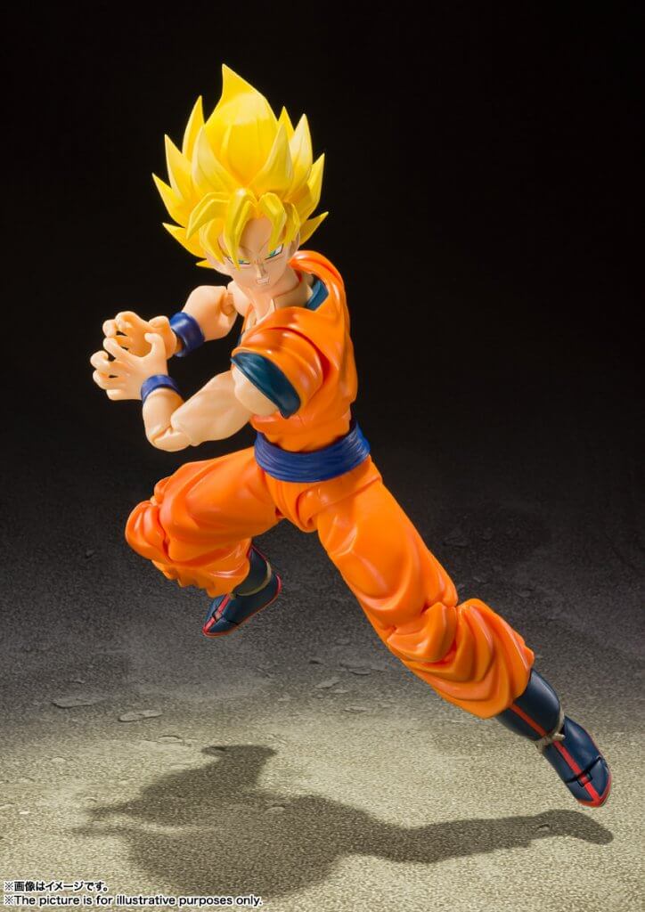 Action figure in orange and blue outfit with yellow hair on a dark background