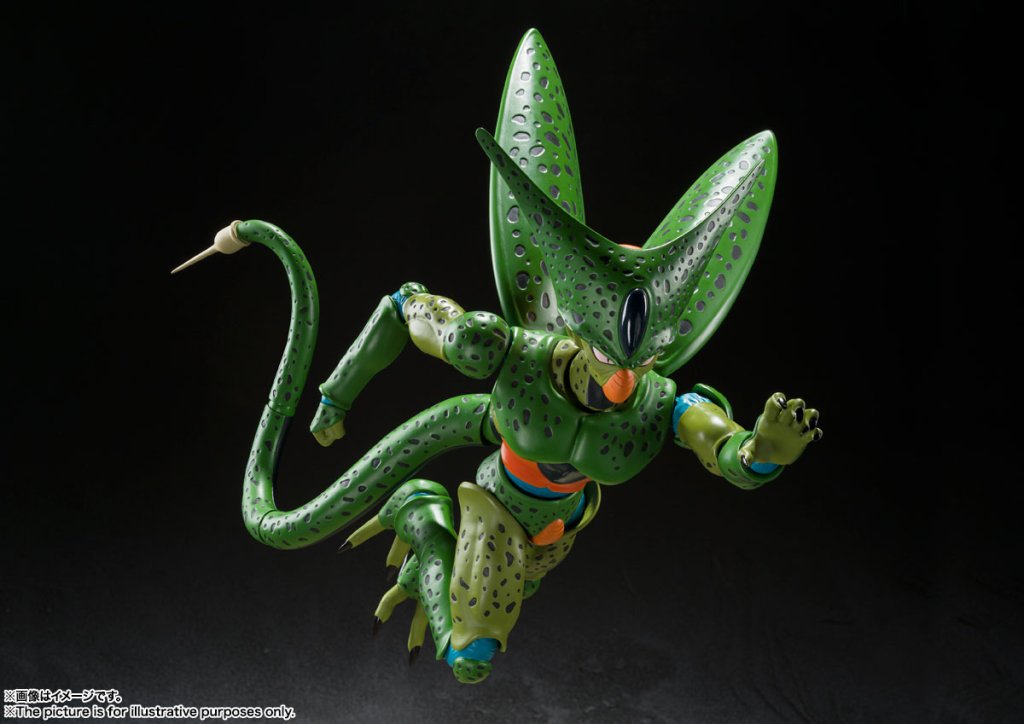 Green alien-like creature figurine on a black background
