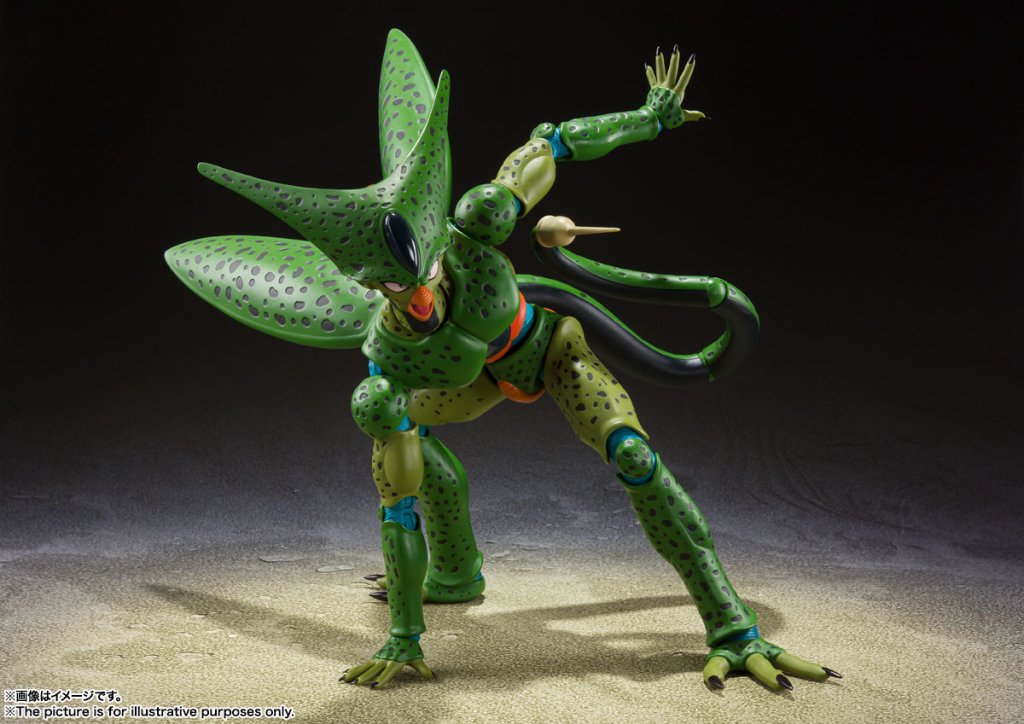 Green alien action figure with detailed design on a dark background