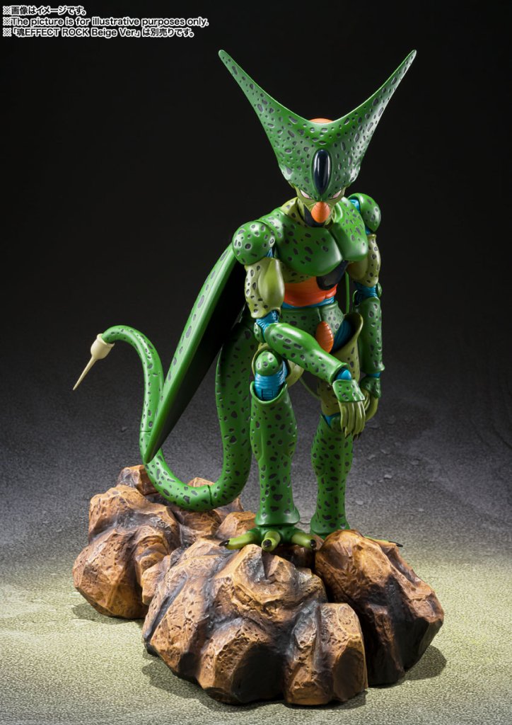 Green alien-like figure on a rocky base with a dark background