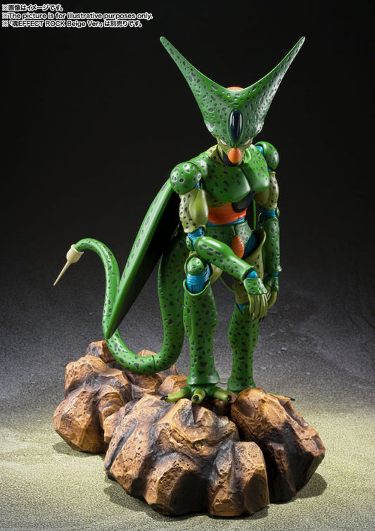 Green alien-like figure on a rocky base with a dark background