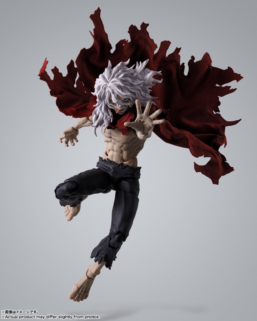 Action figure with red and black cape in dynamic pose on gray background
